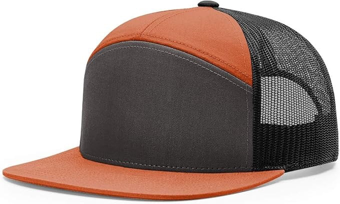“Richardson 168 7-panel trucker hat in burnt orange and charcoal with black mesh back and flat bill, ideal for custom leather patch design.”