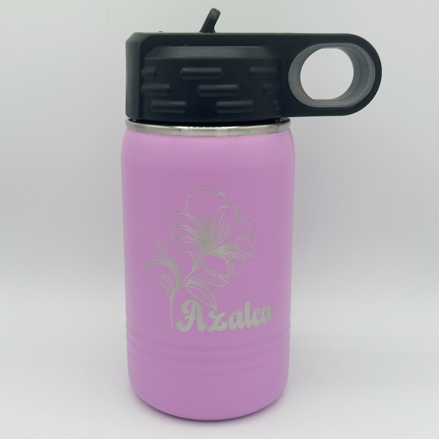"Custom personalized pink Polar Camel 12oz stainless steel kids' water bottle with a black flip-top lid and handle. The bottle features an elegant engraved floral design with the name 'Azalea' in a stylish script font."