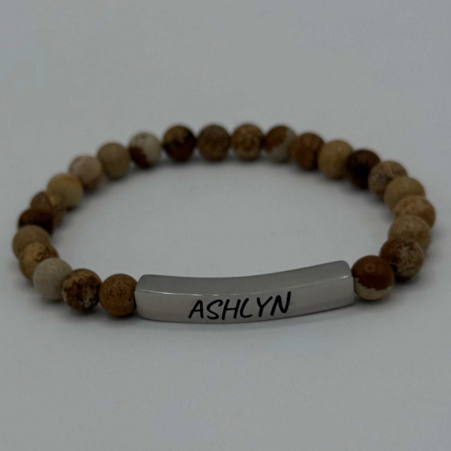 "Personalized Picture Jasper bracelet by Moon and Skye Creations, featuring a sleek silver bar for custom engraving. This handcrafted piece blends earthy elegance with individuality, making it a meaningful accessory for any style."