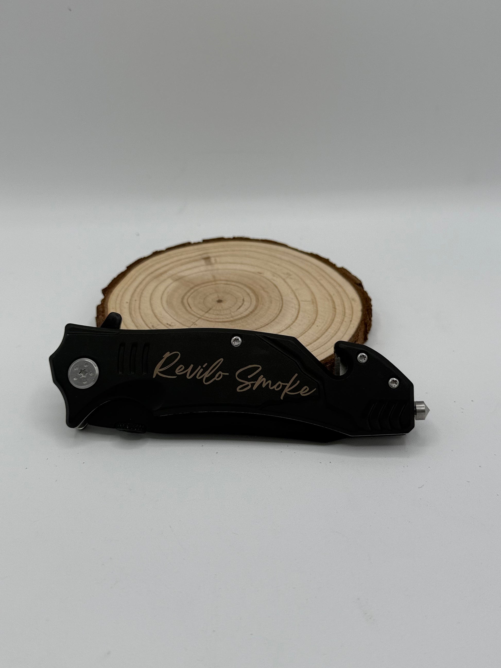 Red personalized rescue knife with black blade, partial serrated blade, seatbelt cutter, and glass breaker.