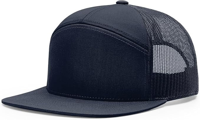 Richardson 168 7-panel trucker hat in navy blue with black mesh back and flat bill, perfect for custom leather patch branding.