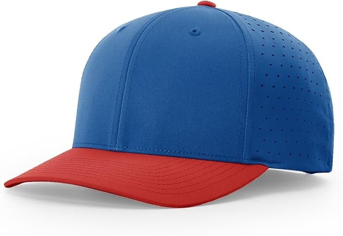 Richardson laser perforated snapback hat with royal blue crown, red curved bill, and breathable side panels, ideal for custom leather patch branding.