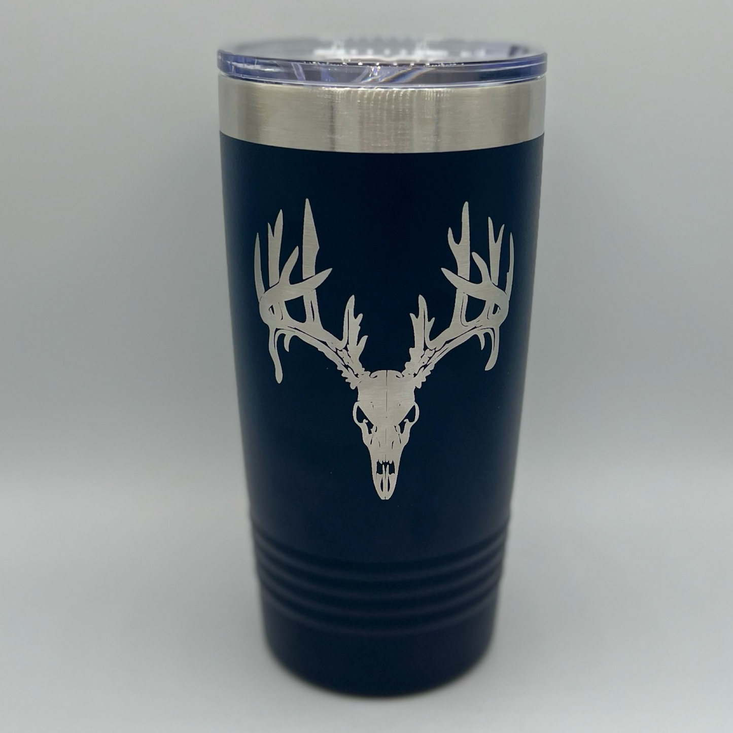 "Navy 20 oz Polar Camel tumbler with laser-engraved deer skull and antlers design — rugged stainless steel travel mug perfect for hunters, outdoorsmen, and wildlife enthusiasts."